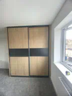 Oak Panel doors with a graphite grey strip in charcoal frames, fitted in Skelton